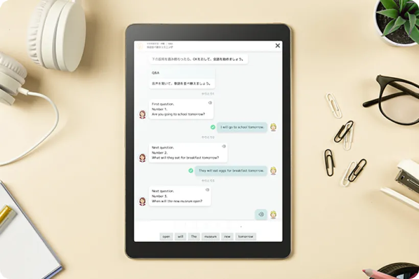タブレットでチャット形式の学習画面を閲覧している様子